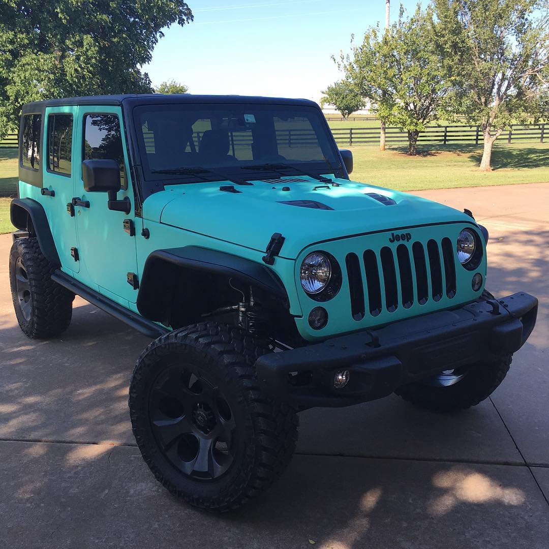 Jeep Rubicon wrapped in Avery SW Matte Vintage Green Vinyl with Clear  Carbon Fiber overlam